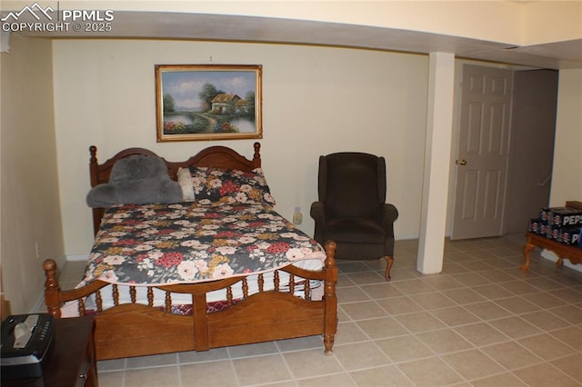 bedroom with light tile patterned floors