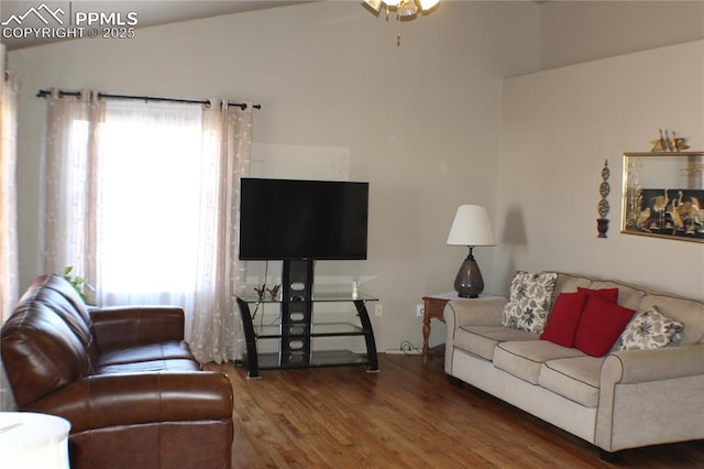 living area with a ceiling fan and wood finished floors