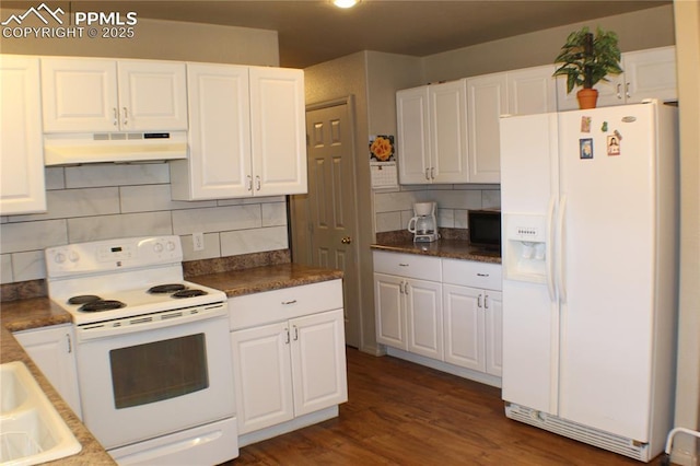 kitchen featuring under cabinet range hood, backsplash, dark wood-style floors, white cabinetry, and white appliances