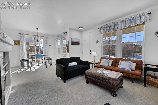 living area featuring carpet floors and an inviting chandelier