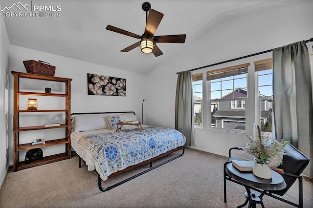 bedroom featuring a ceiling fan, vaulted ceiling, and carpet flooring