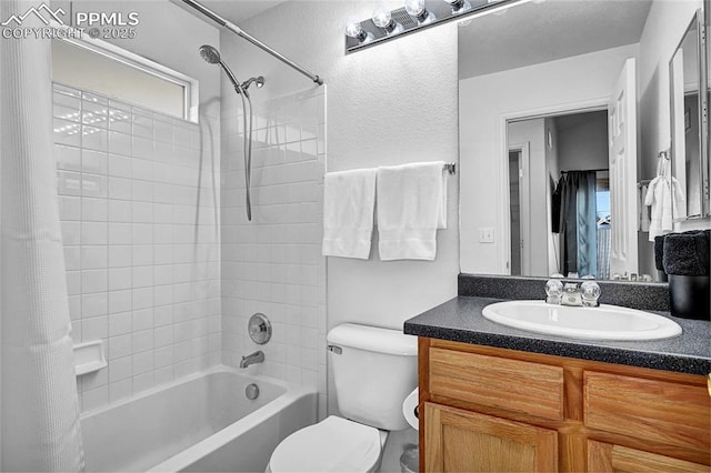 bathroom with shower / bath combination with curtain, vanity, and toilet