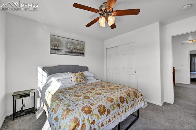 carpeted bedroom with a closet, ceiling fan, and baseboards