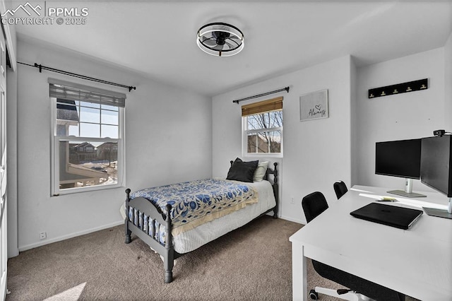 bedroom featuring carpet floors and baseboards