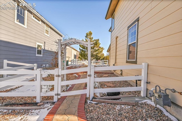 view of home's exterior featuring fence