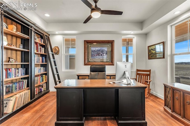 office area featuring ceiling fan, recessed lighting, light wood-type flooring, and baseboards