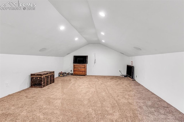 additional living space featuring lofted ceiling, carpet, and recessed lighting