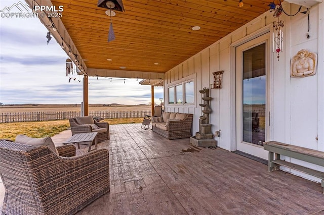 view of patio with fence and outdoor lounge area