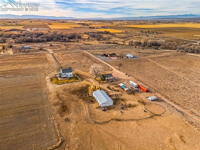 bird's eye view featuring a desert view and a rural view