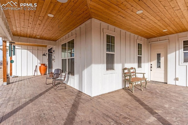 doorway to property with board and batten siding