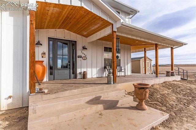 entrance to property featuring board and batten siding