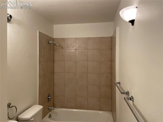 bathroom with bathtub / shower combination and toilet