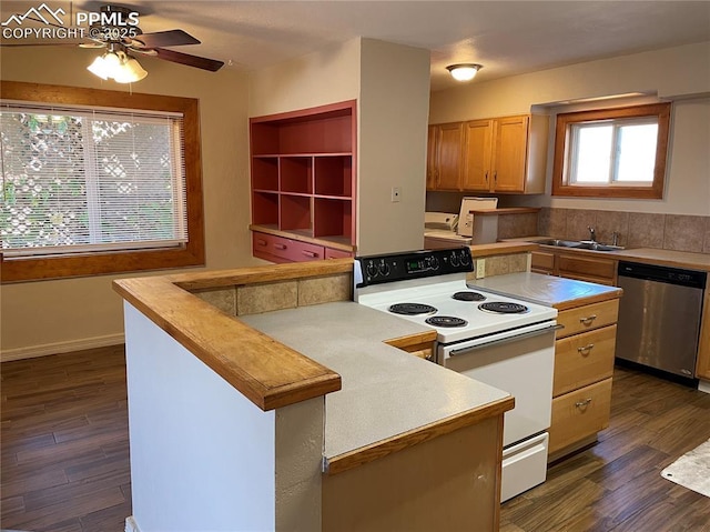 kitchen with dark wood-type flooring, electric stove, dishwasher, and a sink