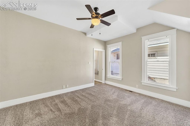 909 E 10th St, Pueblo, CO 81001 - carpeted spare room with a ceiling fan, visible vents, vaulted ceiling, and baseboards