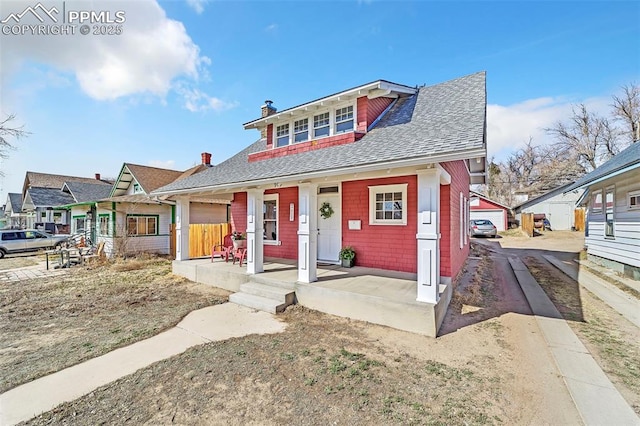 909 E 10th St, Pueblo, CO 81001 - bungalow-style home with driveway, a porch, a chimney, and a shingled roof