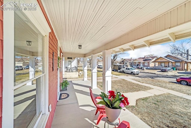 909 E 10th St, Pueblo, CO 81001 - view of patio featuring covered porch and a residential view