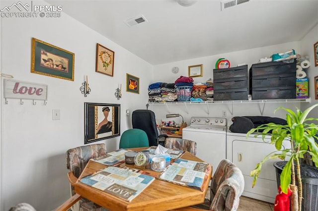 dining room with visible vents and washing machine and clothes dryer