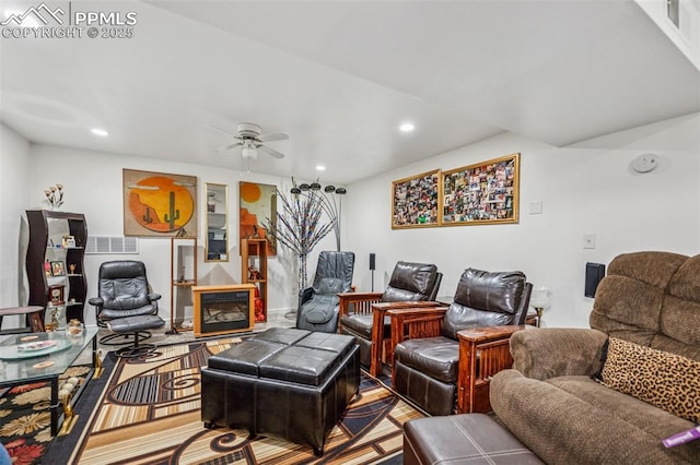 living area with recessed lighting, visible vents, ceiling fan, and a fireplace