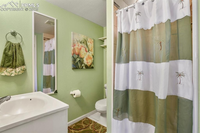 bathroom featuring vanity, visible vents, baseboards, tile patterned flooring, and toilet