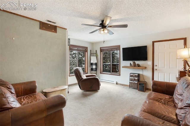 carpeted living area featuring baseboards, a textured ceiling, visible vents, ceiling fan, and baseboard heating
