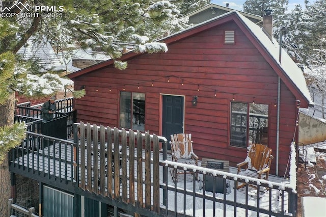 view of snow covered house