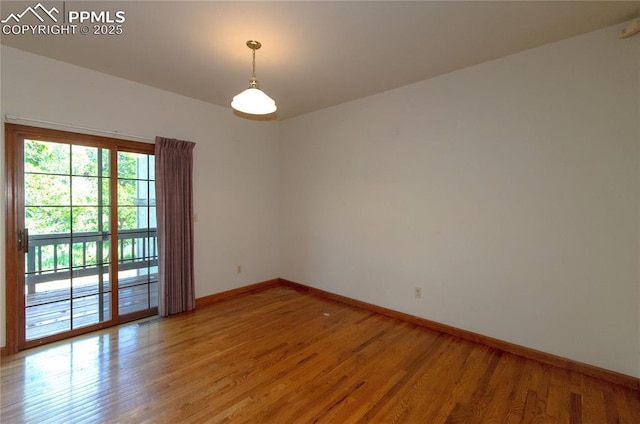 3012 S Electra Dr, Colorado Springs, CO 80906 - empty room with baseboards and light wood-style flooring