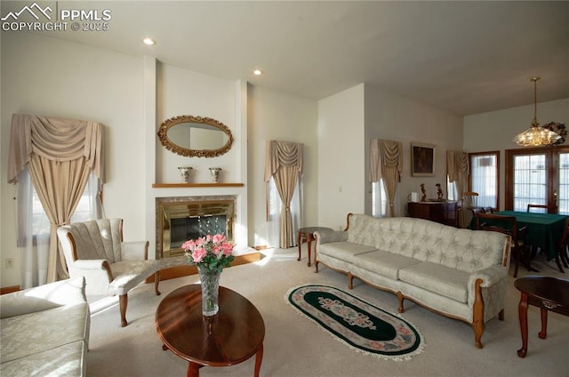 3012 S Electra Dr, Colorado Springs, CO 80906 - carpeted living room with a glass covered fireplace, billiards table, recessed lighting, and a chandelier