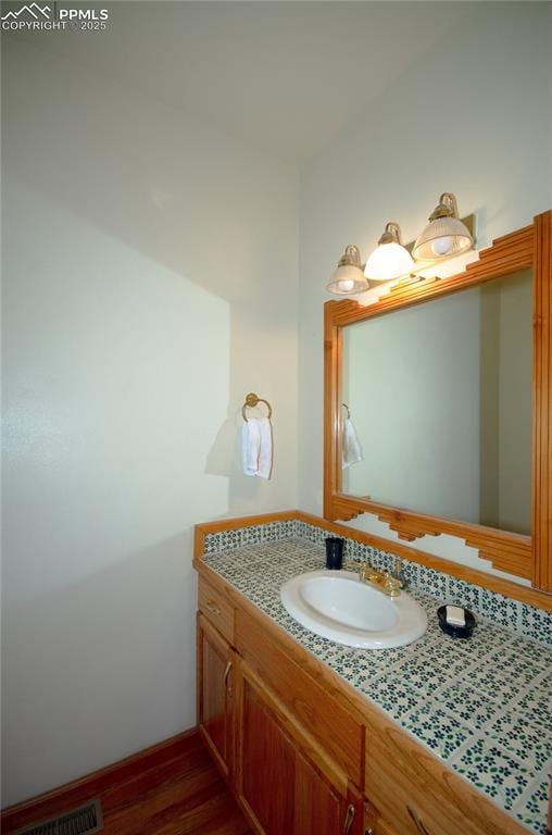 3012 S Electra Dr, Colorado Springs, CO 80906 - bathroom with vanity and wood finished floors