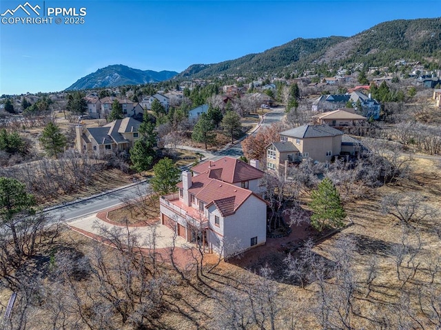 3012 S Electra Dr, Colorado Springs, CO 80906 - aerial perspective of suburban area with a mountainous background