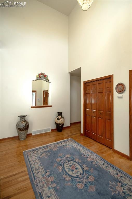3012 S Electra Dr, Colorado Springs, CO 80906 - foyer entrance featuring high vaulted ceiling and wood finished floors