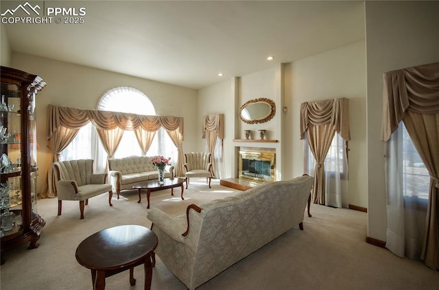 3012 S Electra Dr, Colorado Springs, CO 80906 - carpeted living area featuring a glass covered fireplace and recessed lighting