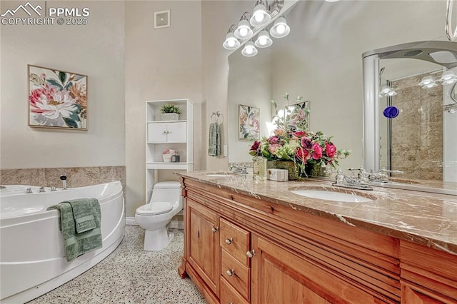 bathroom with a bath, visible vents, speckled floor, and a sink