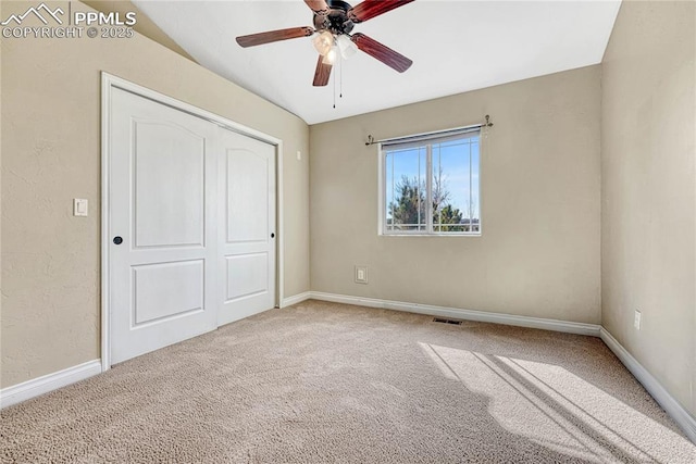 unfurnished bedroom featuring visible vents, carpet flooring, and baseboards