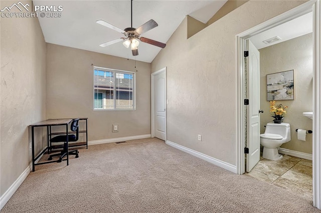 carpeted bedroom with visible vents, baseboards, a textured wall, and vaulted ceiling