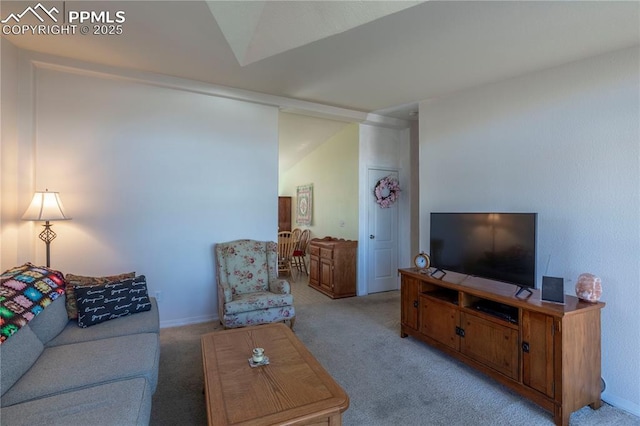 living room with baseboards and light colored carpet