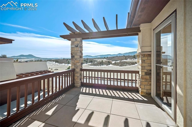 balcony featuring a mountain view