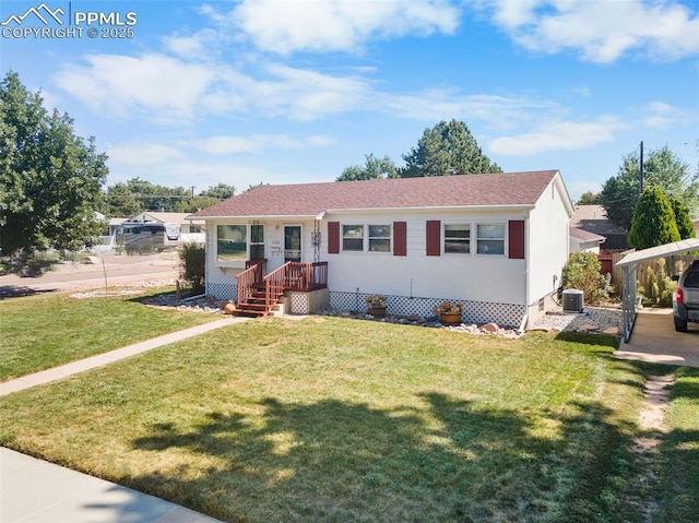 view of front of property with a front lawn and central AC