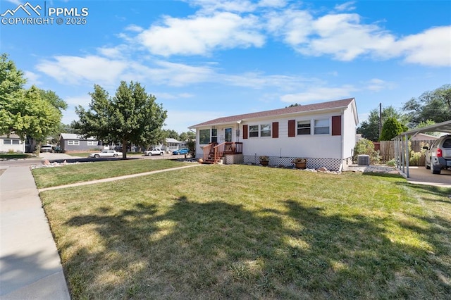 view of front of home with central AC, a front yard, and fence