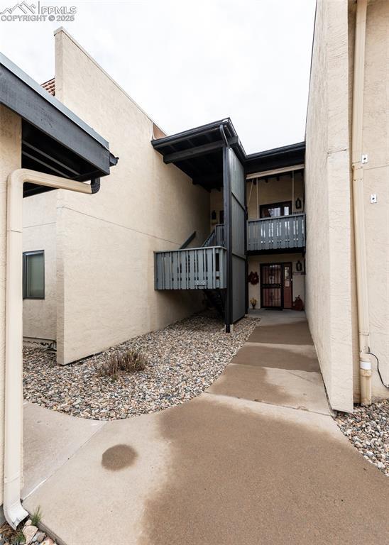 view of side of property featuring stucco siding