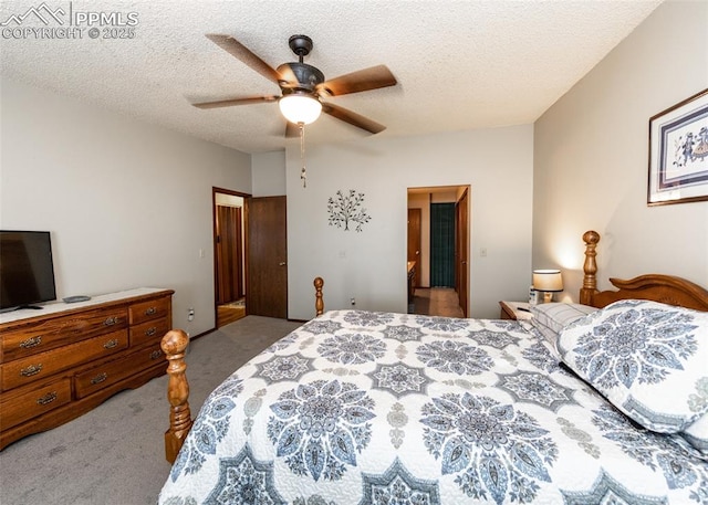 bedroom featuring ceiling fan, carpet flooring, and a textured ceiling