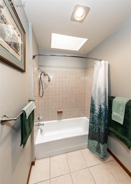 full bath with tile patterned flooring, a skylight, and shower / bath combo