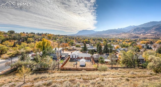 drone / aerial view featuring a residential view and a mountain view