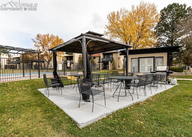 view of patio / terrace with french doors, a community pool, a grill, and fence