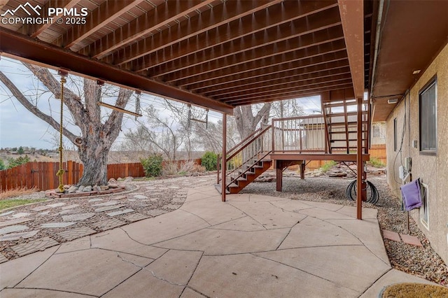 view of patio / terrace with stairs and a fenced backyard