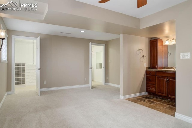 bathroom with recessed lighting, vanity, baseboards, and a ceiling fan