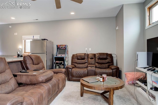 living area featuring recessed lighting, light carpet, and ceiling fan