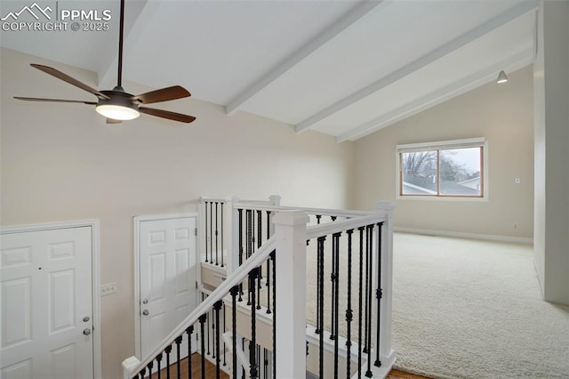 corridor with vaulted ceiling with beams, an upstairs landing, baseboards, and carpet floors