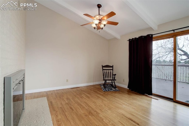 unfurnished room with baseboards, vaulted ceiling with beams, light wood-style floors, and a ceiling fan