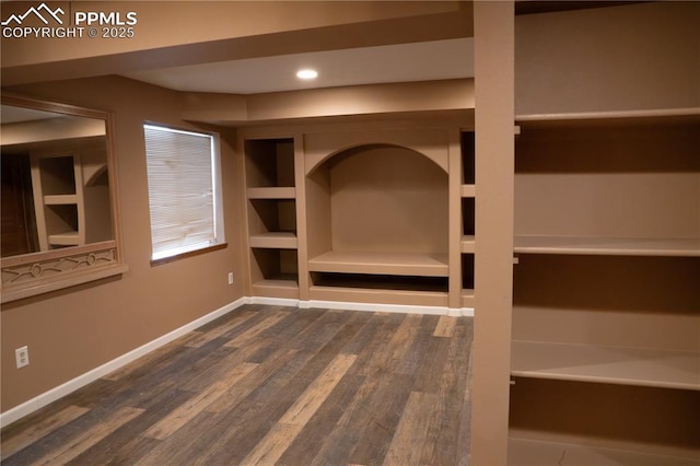 interior space featuring recessed lighting, baseboards, and wood finished floors