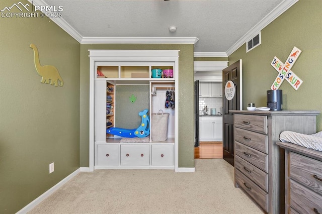 bedroom featuring visible vents, carpet flooring, and ornamental molding